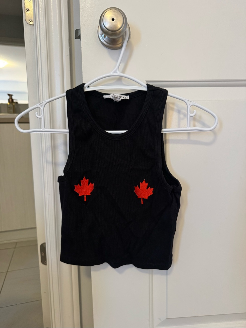 Urban Heritage Black Ribbed Tank Top with Red Maple Leaf Motifs